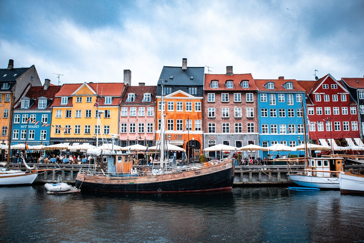 gallery-6 Vibrant townhouses line the historic Nyhavn canal in Copenhagen, Denmark, showcasing its lively waterfront culture.